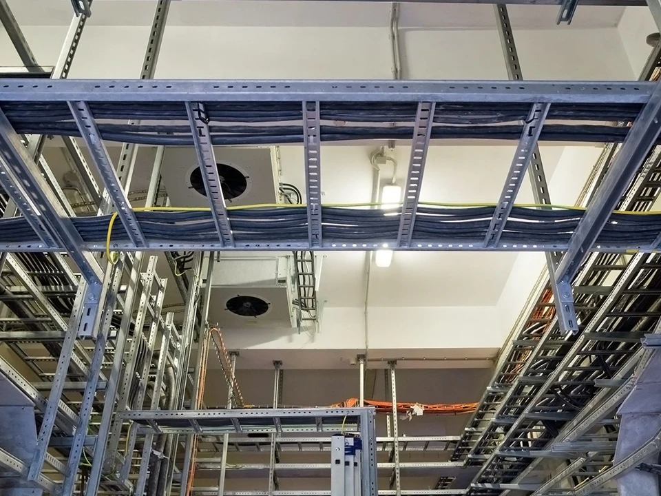 U-shaped steel cable ladder within an industrial facility
