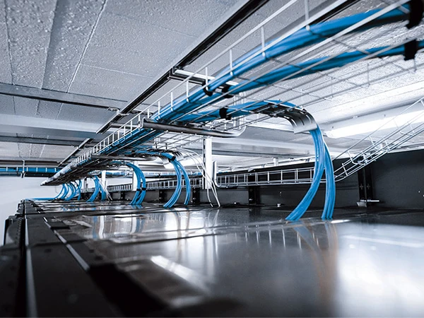 Mesh cable tray mounted on top of data center cabinets
