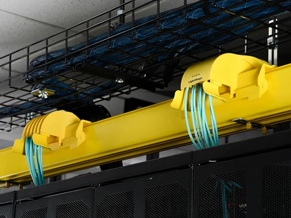 Close-up view of the cable outlet on fiber cable trays