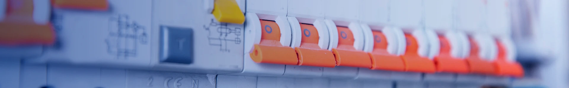 A row of circuit breakers inside a distribution cabinet